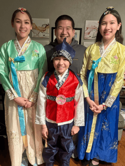 AJ with his three children, celebrating Korean New Year